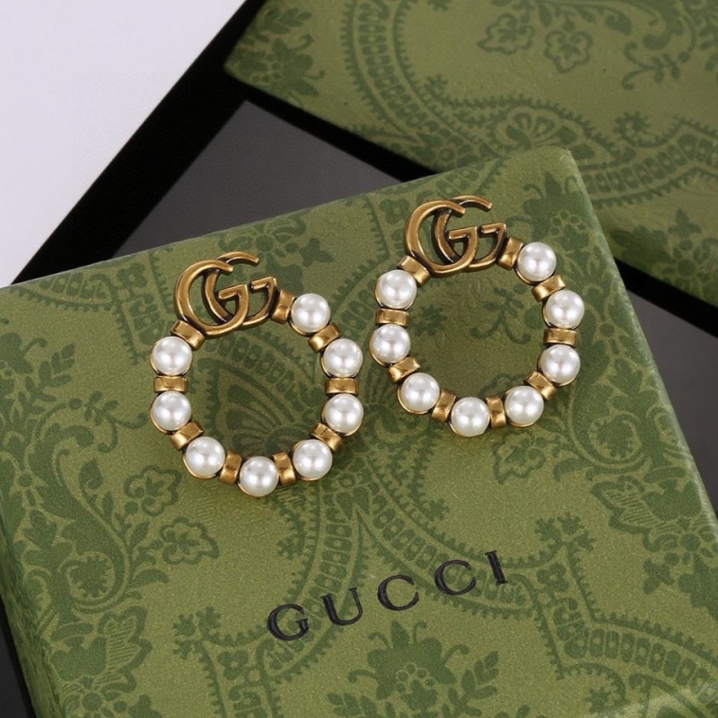 G*u*i earrings